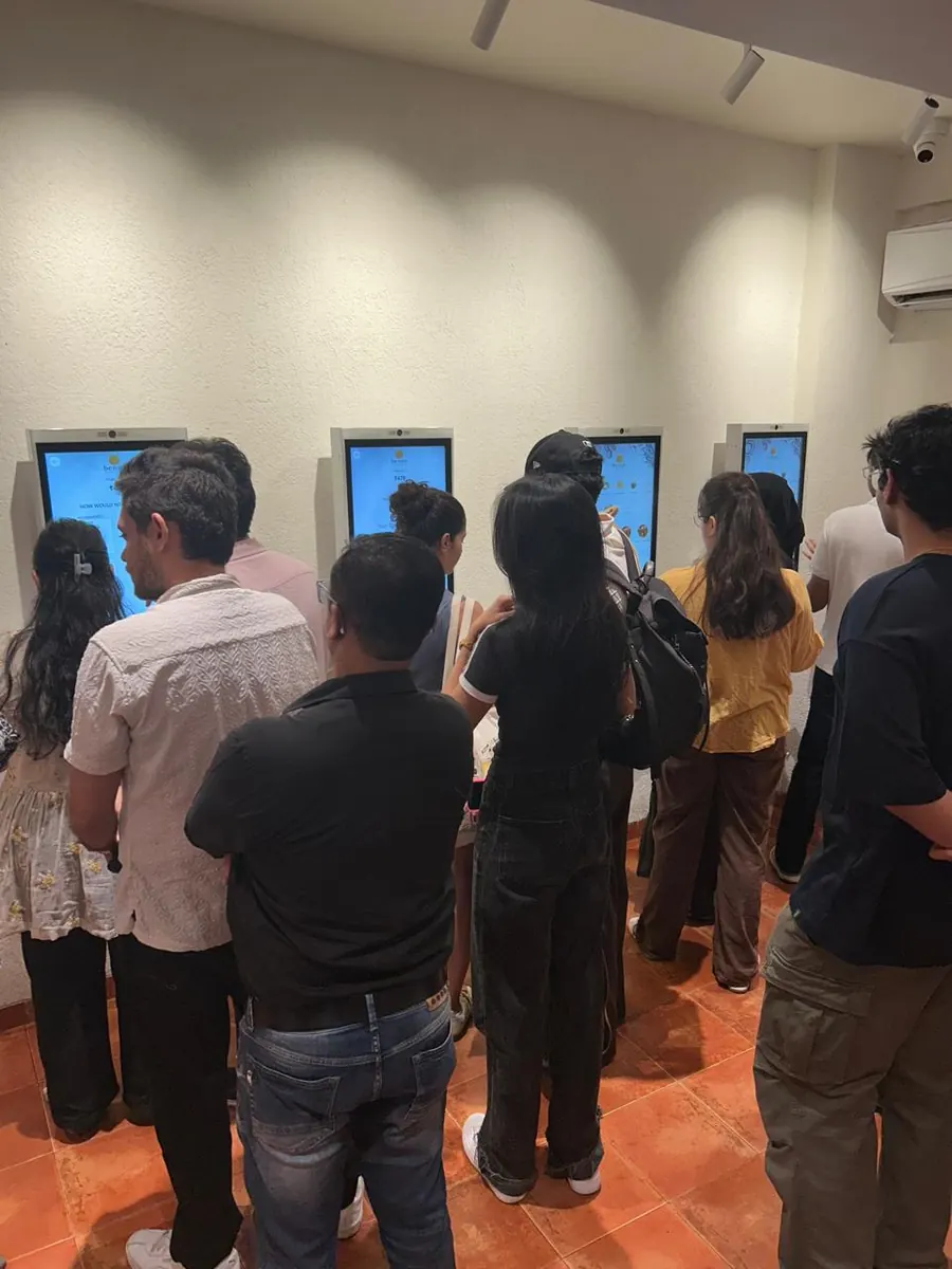 Guests using multiple PALAS self-ordering kiosks during service