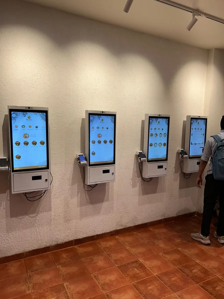 PALAS wall-mounted kiosks installed in a restaurant